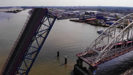 Drawbridge-At-Dutch-River-With-Ship-On-Background-Over-Noord-In-Alblasserdam-In-The-Netherlands