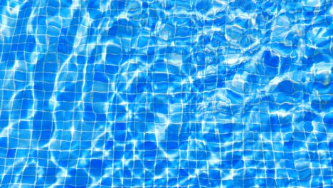 water ripples in swimming pool tile background