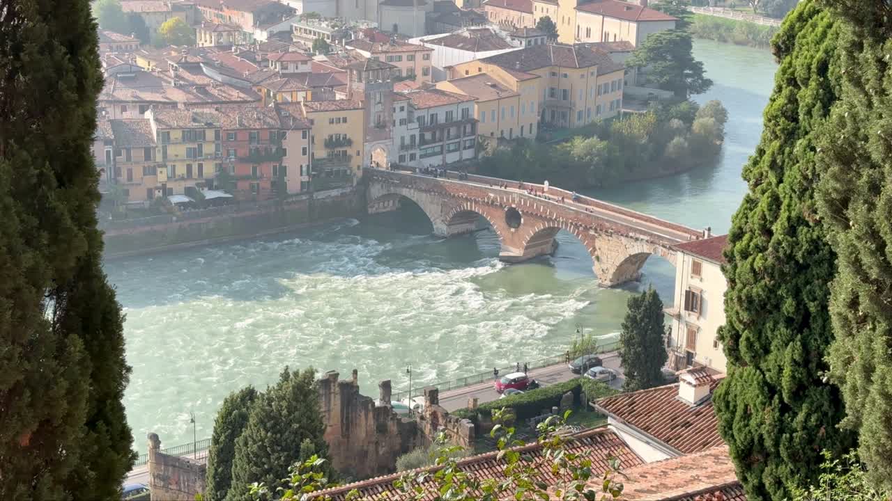 Landscape of Verona city with Adige river and Ponte Pietra river in misty afternoon