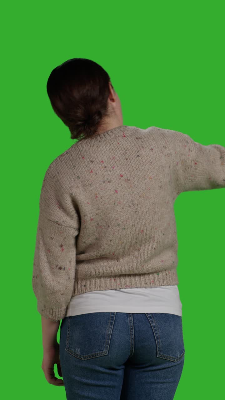 Vertical video: Back view of optimistic adult asking people to come over