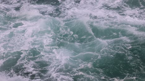 dynamic ocean waves breaking on rocks