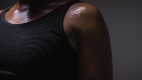 Close-Up-Shot-Of-Beads-Of-Sweat-On-Woman-Wearing-Gym-Fitness-Clothing-Exercising-2