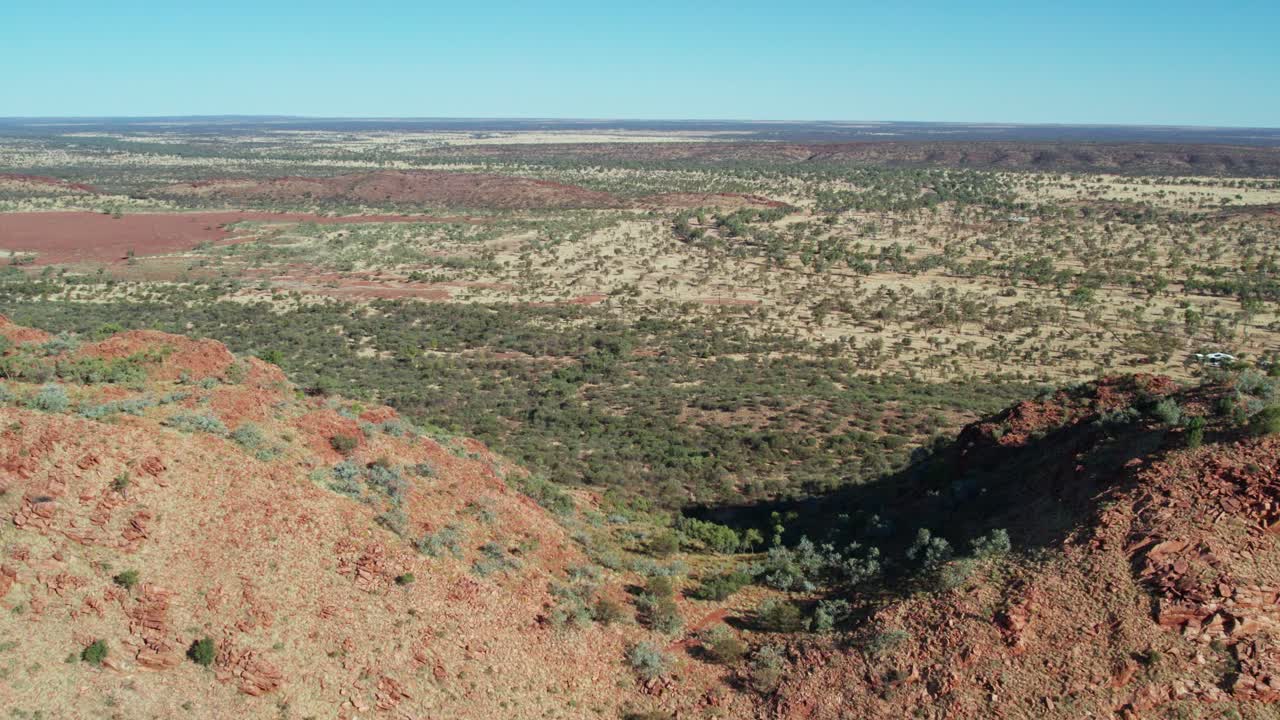 Aerial footage flying over over the MacDonnell Ranges near Roe Creek, in the Northern Territory, Australia. August 2022.