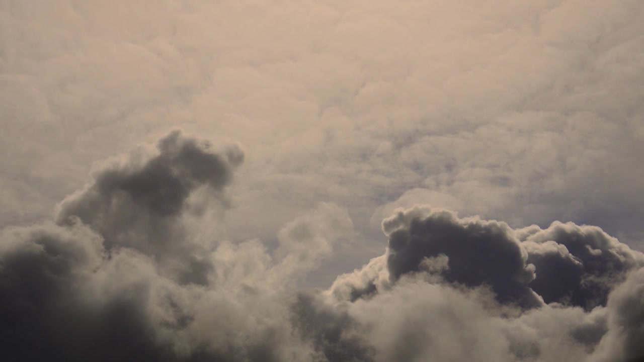 Dramatic High Contrast Rising Storm Clouds in the Sky. Perfect for travel videos, commercial backgrounds, weather related presentations, cinematic compositing plates. 4K.