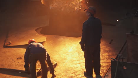 metal workers in a foundry