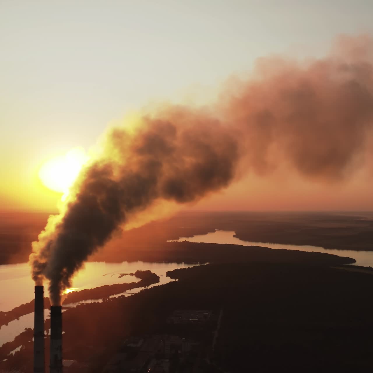 High voltage post. High-voltage tower sky background, factory pipe with smoke over it. Earth pollution and industrialization concept. Selective focus