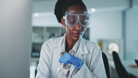black woman, gloves and plant in test tube