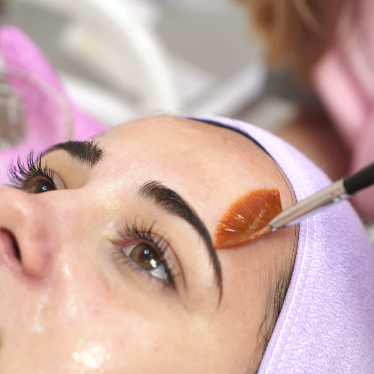 Cleansing peeling in the beauty salon. Cosmetic treatment of face. Aesthetic cosmetology.