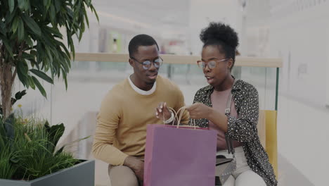 happy couple shopping at the mall