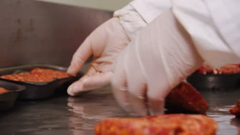 butcher checking meat balls