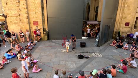 entertainer performs for a gathered audience