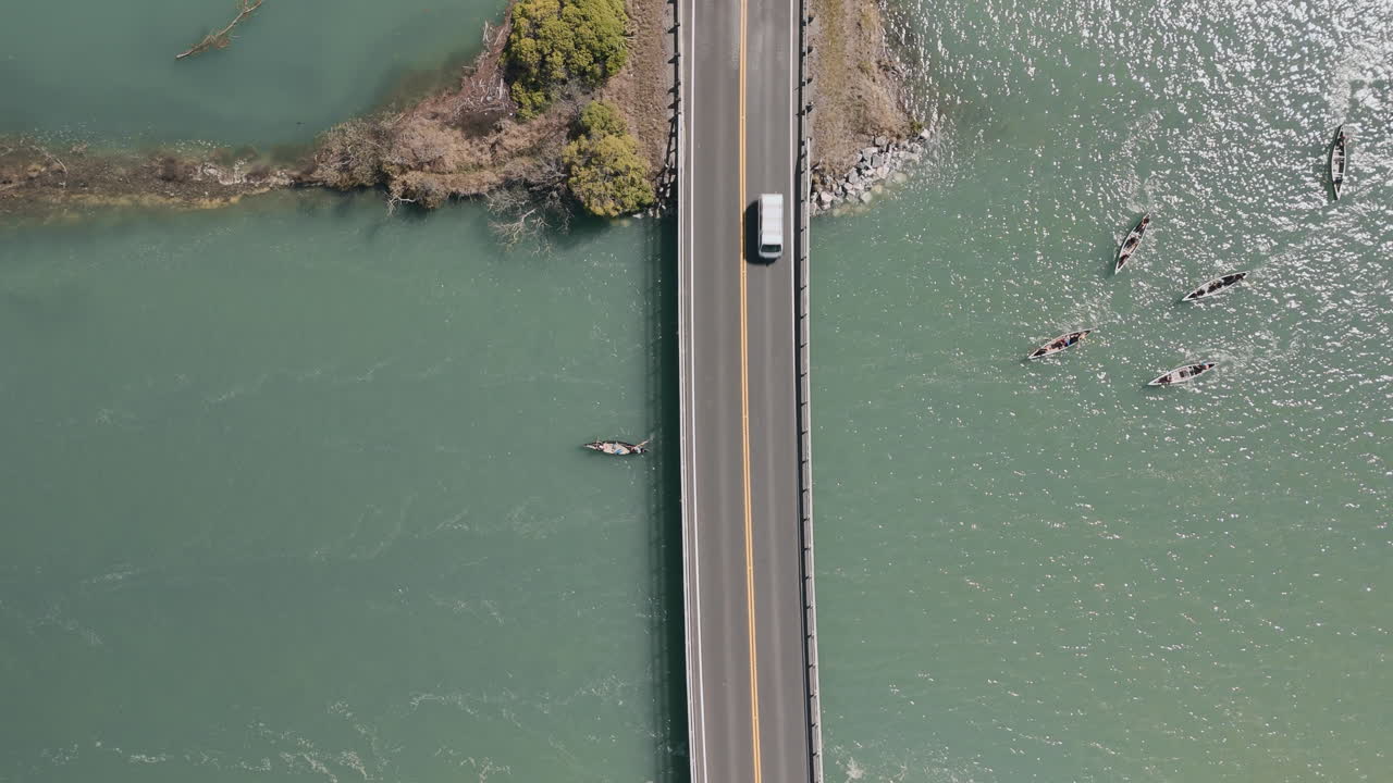 Road Bridge Over River with Canoes