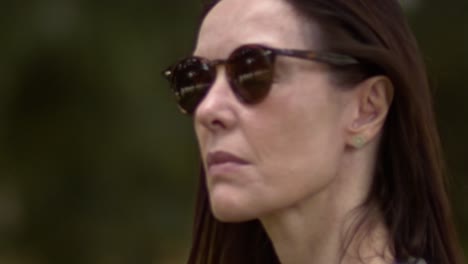 slow motion, sensual beautiful woman turns away, sunglasses wearer