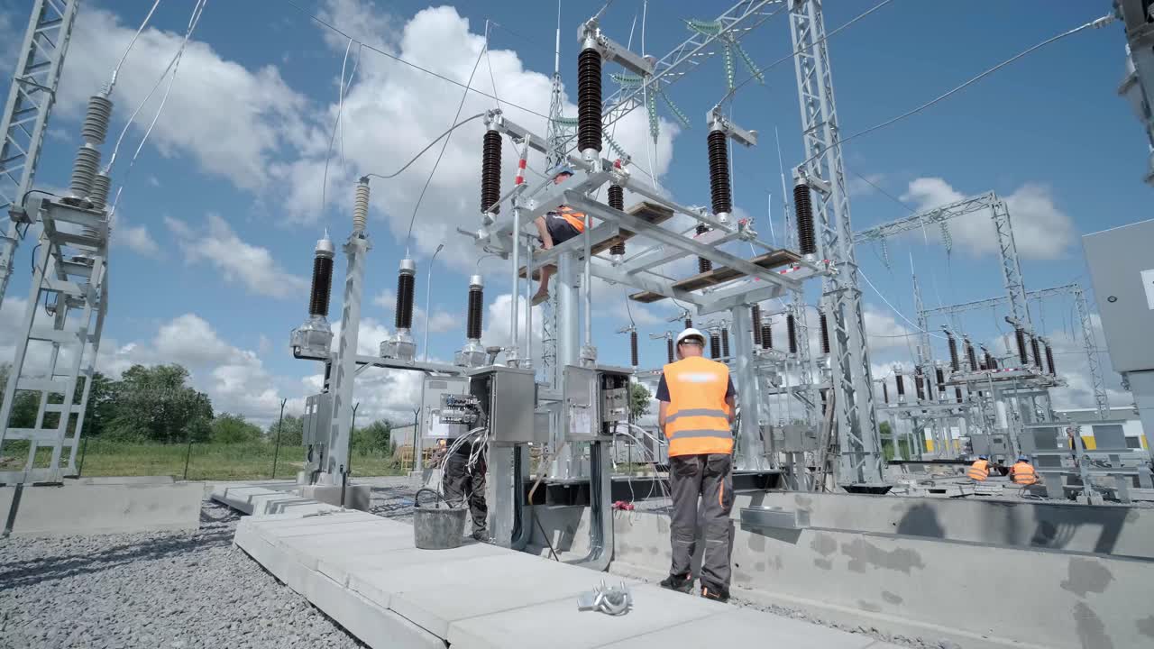 Construction of a transformer substation. Electrical engineer control wiring electric power on steel tower, Electric construction and maintenance services throughout, Electric Power Transmission Infrastructure, Highest voltage transmission