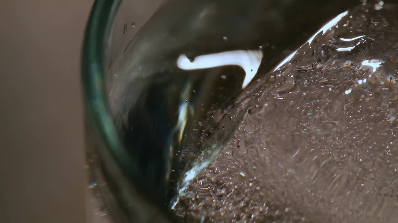 Glass with ice and water 4k