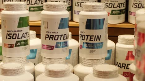 sport nutrition store interior with large choice of nutritional supplements.