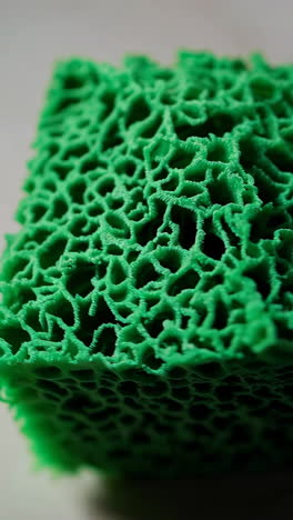 close-up view of a 3d printed green mesh object