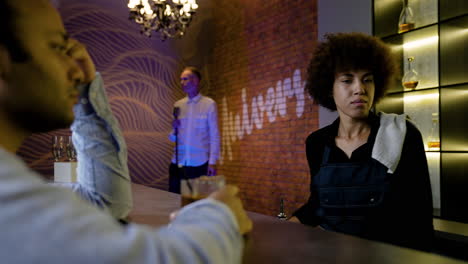 man drinking in a pub