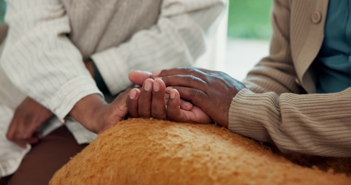 Close-up of Two People Holding Hands for Comfort and Support