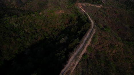 Aerial-pan-out-shot-of-the-Great-Wall-of-China-ruins-at-Gubeikou-section