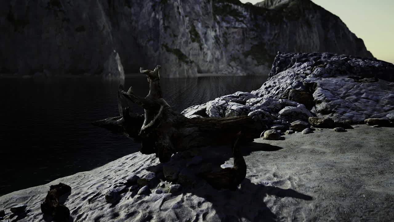 Rocky shoreline along a tranquil lake reflects serene natural beauty
