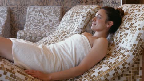 brunette relaxing in thermal suite