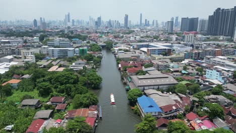 city and river scenes while following a boat in bangkok, thailand