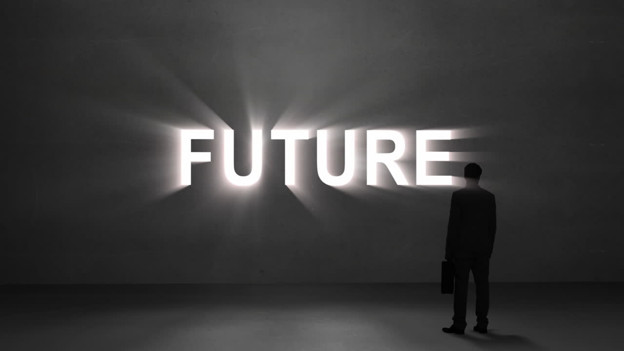 Businessman looking at giant future text