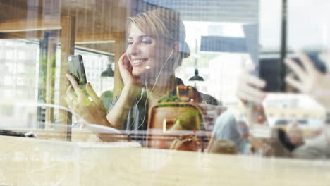 beautiful woman video messaging conference call tablet in cafe