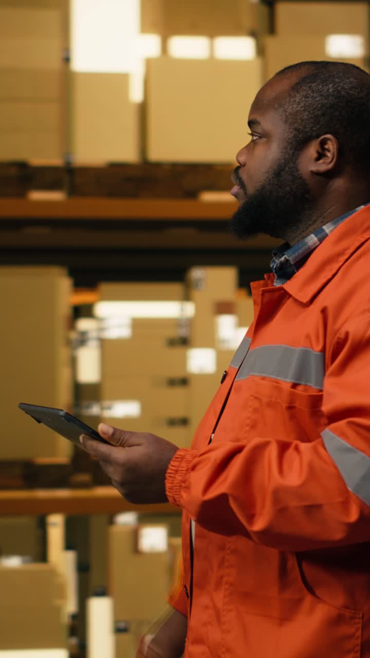 Vertical Video African American Staff Member Using Tablet For Package Inventory Control