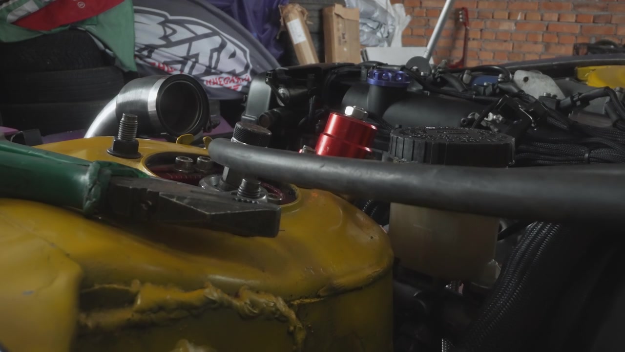 Detailed Shot of a Modified Car Engine in a Workshop