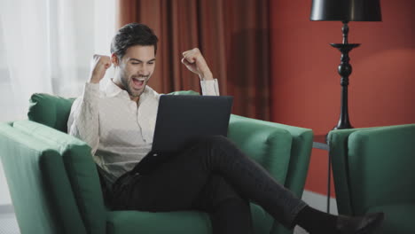 Businessman-working-laptop-at-remote-workplace.-Happy-man-getting-good-news