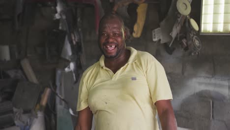 african handyman looking at camera