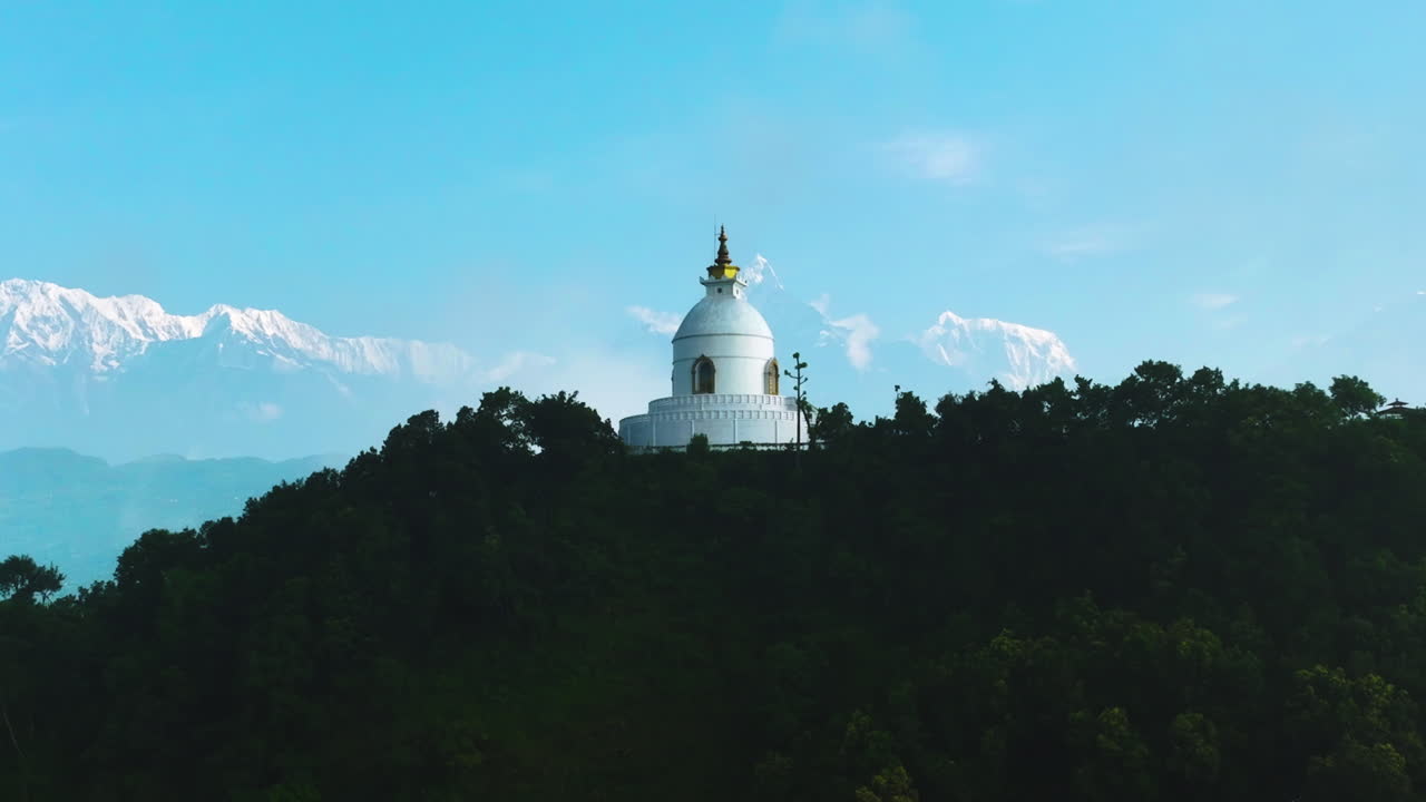 Nepal's Annapurna mountain range in background with Peace Stupa, Pokhara tourism landscape