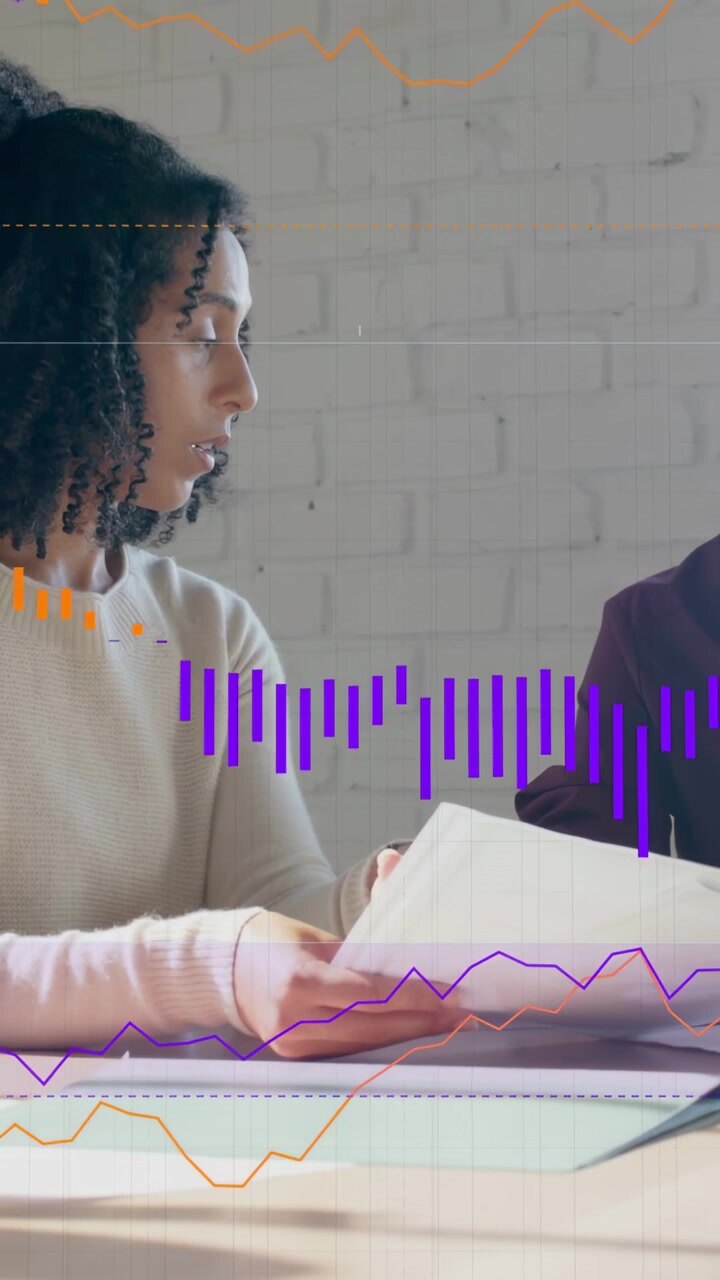 Vertical video: Lifting woman in sweater scanning and handing docs at office with charts for review