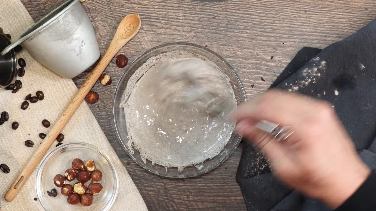 A delicious dessert, Coffee Hazelnut Cream Tart. Made with espresso powder, chocolate crust and loaded with crushed hazelnut. Using a whisk to combine ingredients such as expresso powder and milk