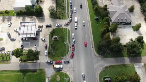 drone shot of cars waiting in line for gas