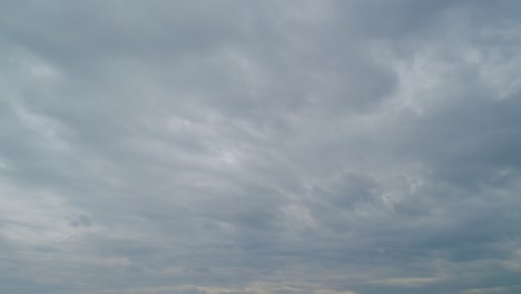 dark storm clouds dramatic shadowy sky background. dark grey storm clouds. time lapse.