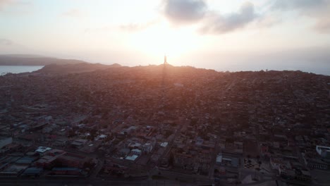 panoramic view coquimbo cityscape with the cross of the millennium background during sunset in chile