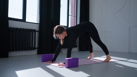 woman doing yoga with blocks