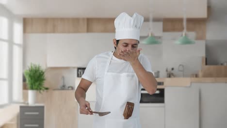 indian professional chef tasting spicy food