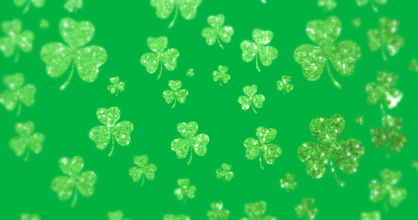 Loop starting, glitter clovers parallaxing on transparent bg, bits popping, stars flashing, looping