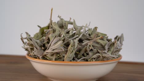 sage herb dried collectively in a bowl cinematic shot