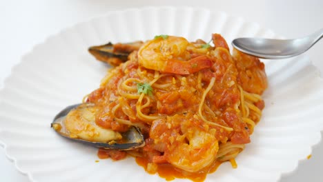 Plate-of-sea-food-pasta-on-table