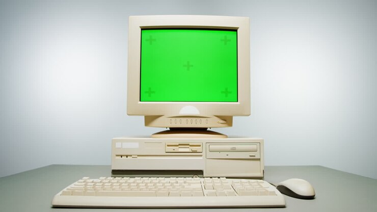 Vintage stationær computer med grøn skærm