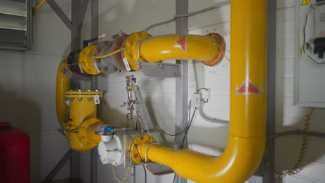 gas flow transporting pipe with flanges in mechanical room