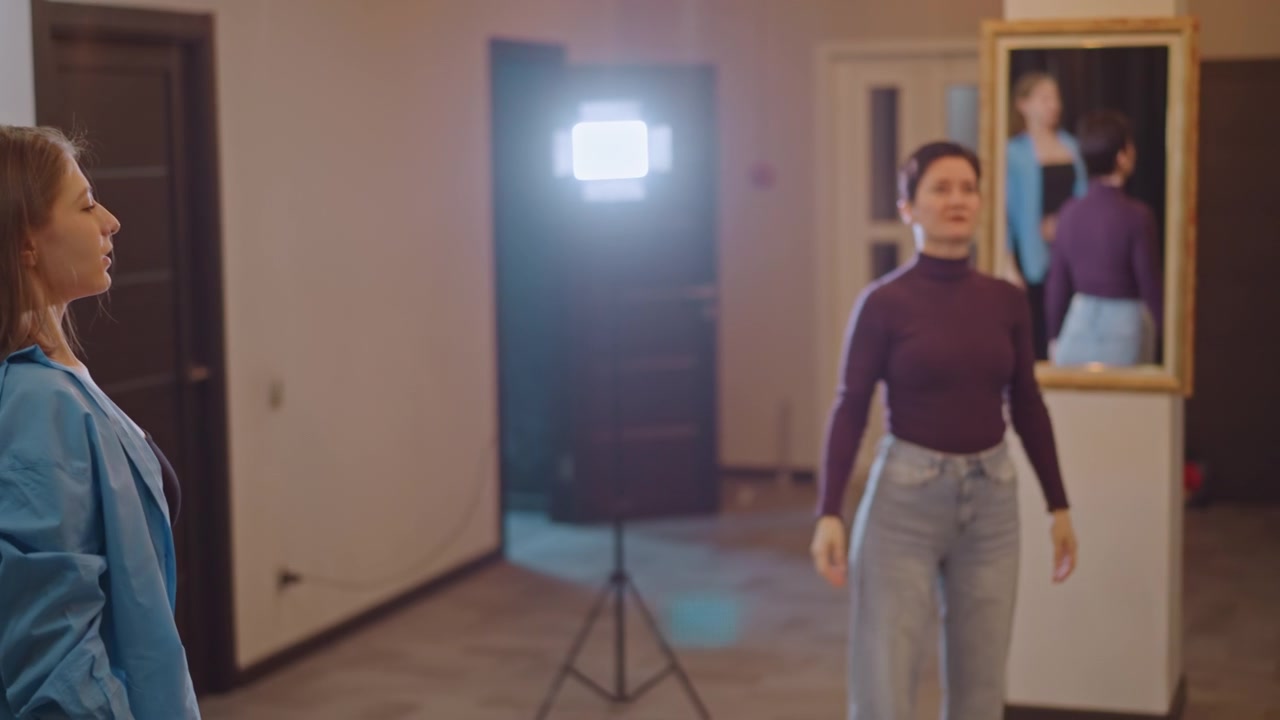 Individuals practice relaxation techniques with warm lighting and focused expressions. Participants collectively perform calming exercises and subtle movements in warmly lit studio environment