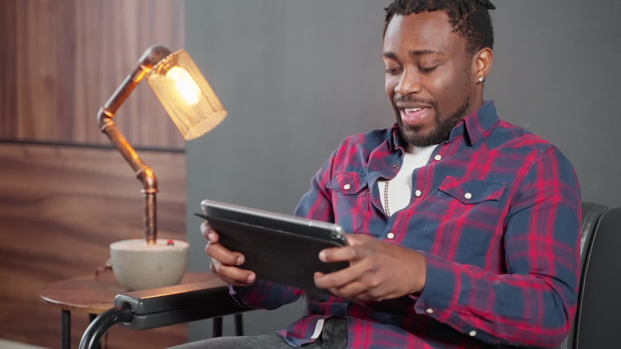 Man using a tablet in a modern home