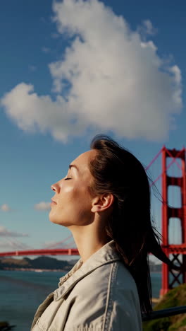 woman enjoying the view of the golden gate bridge