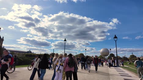 crowded parisian park on a sunny day